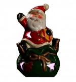 Pere noel sur sac de noel lumineux
